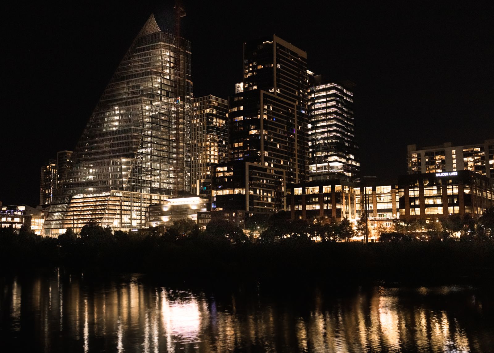 Downtown Austin skyline reflected in the river at dusk