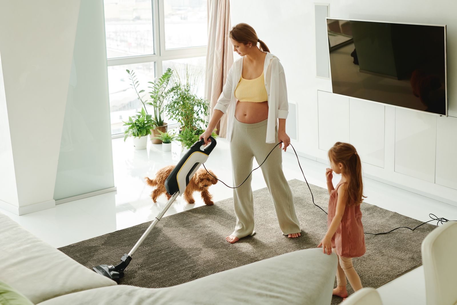 Parent and child relaxing in a freshly cleaned living room